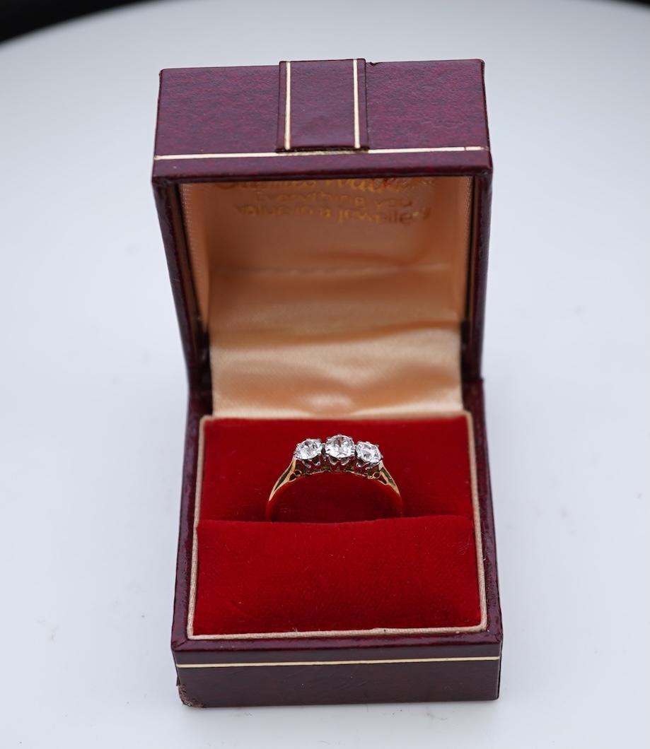 A three-stone diamond ring, early 20th century